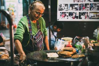 A woman in Chiang Mai, Thailand, preparing street food