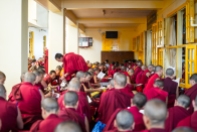 Tibetan Monks and Tibetan people praying in the Dalai Lama Temple in McLeod Ganj, Dharamsala, Inidia